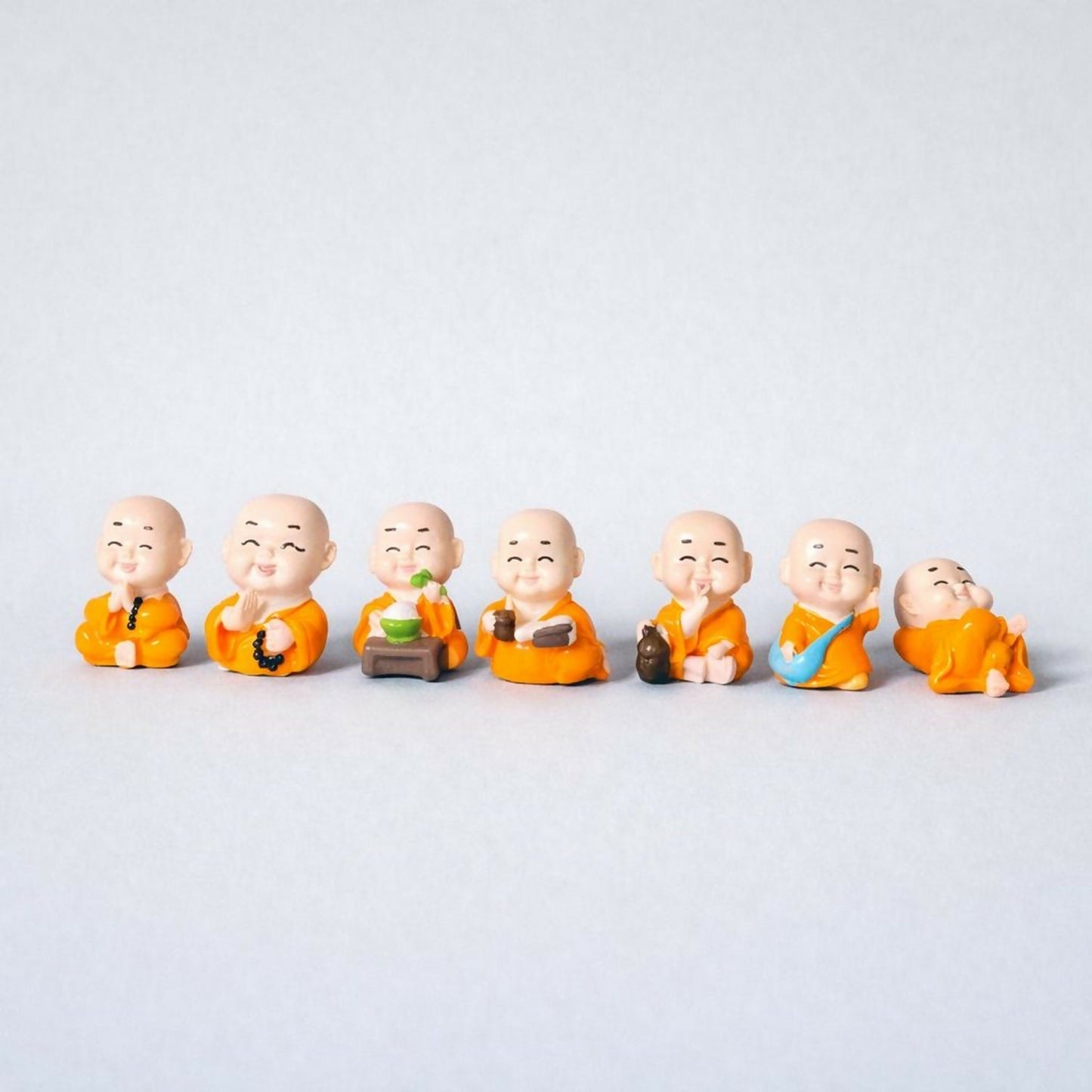 Smiling Monk Showpiece Set of 8 | Mini Buddha Figurines for Home Decor